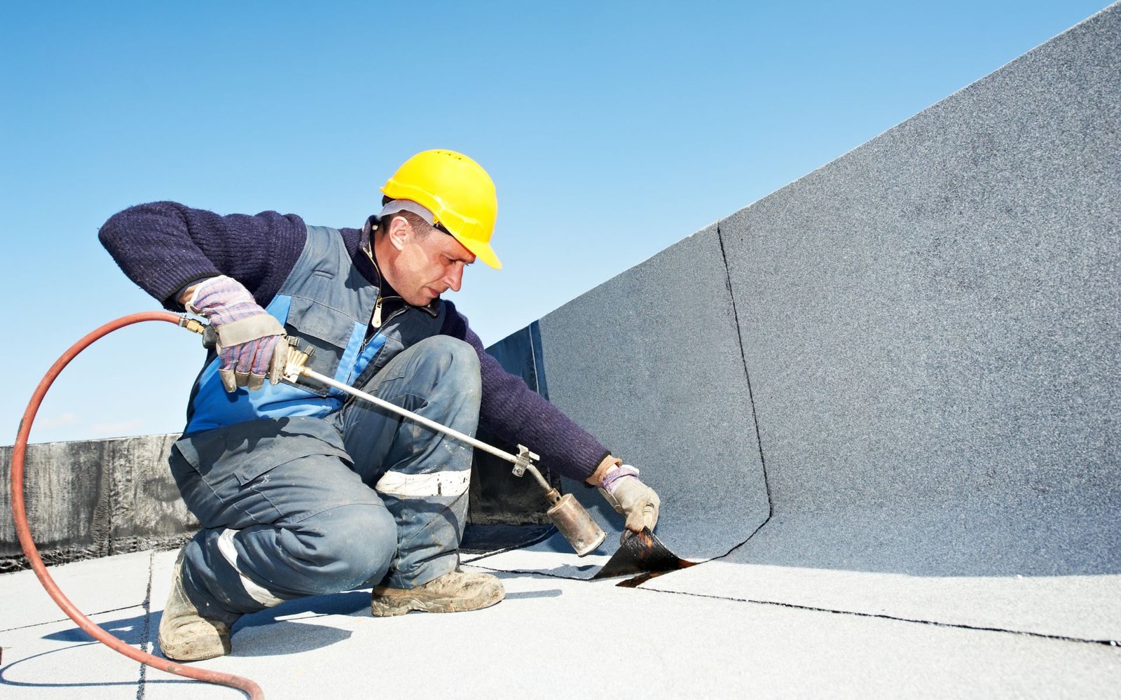 Flat roof repair in progress on a London commercial property